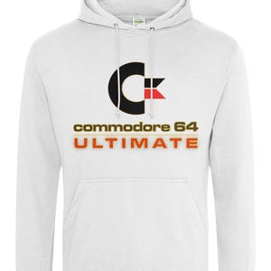 May include: White hooded sweatshirt with a front pocket and drawstring. The front features the Commodore 64 logo in black, red, and gold, with the words "commodore 64 ULTIMATE" printed below. A classic, comfortable hoodie.