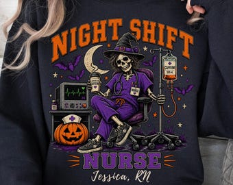 May include: A black crewneck sweatshirt featuring a graphic of a skeleton nurse in a purple scrub set and witch hat, holding a coffee cup. The design includes a pumpkin, IV drip, heart monitor, bats, and the text "NIGHT SHIFT NURSE Jessica, RN".
