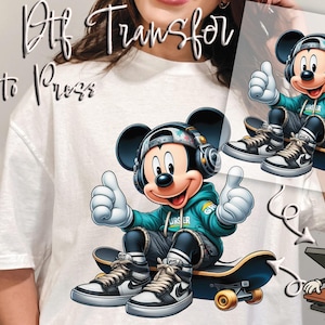 May include: DTF transfer featuring a cartoon Mickey Mouse character wearing a teal hoodie, headphones, and sneakers, seated on a skateboard. The image shows Mickey giving a thumbs-up gesture. The words "Ready to Press" are written in cursive.