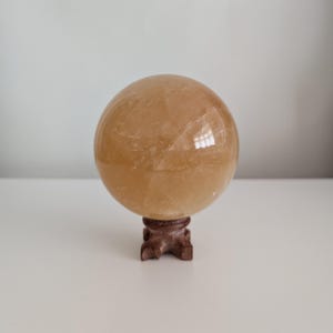 Polished Honey Calcite Sphere (90mm) with Wooden Stand - Decorative Mineral