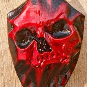 Custom Harley-Davidson horn cover with 3D teardrop skull stretching through
