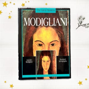 May include: A hardcover book titled "MODIGLIANI" from "The Great Masters" series. The cover features a portrait of a woman with a yellow face and brown hair. The book also includes a smaller portrait and the text "Illustrated Monographs."