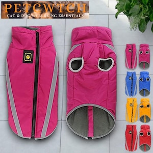 May include: Pink dog jacket with a reflective stripe and a paw print patch. The jacket has a zipper closure and a gray fleece lining. Additional jackets in blue, yellow, and red are also shown.