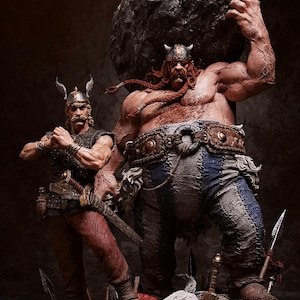 May include: Two Viking warriors, one lifting a large rock, the other holding a sword, stand on a rocky base with a small white dog in front of them.