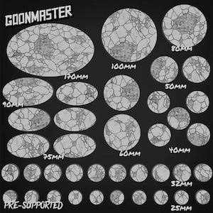 May include: A collection of circular and oval miniature bases featuring a cracked stone texture with debris. The set includes various sizes labelled 25mm, 32mm, 40mm, 50mm, 60mm, 75mm, 80mm, 90mm, 100mm, and 170mm. The text GOONMASTER and PRE-SUPPORTED is visible.