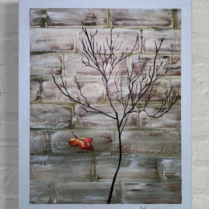 May include: A painting of a bare tree with a single red leaf against a brick wall background. The painting is signed "Harrington" in the bottom right corner.