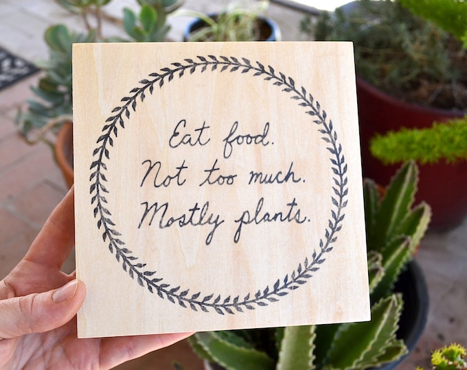 Eat food. Not too much. Mostly plants. - Michael Pollan quote on wood panel; kitchen wall decor