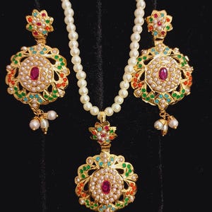 Punjabi jadau pendent set with Kundan Pearls and stones. Indian jewellery