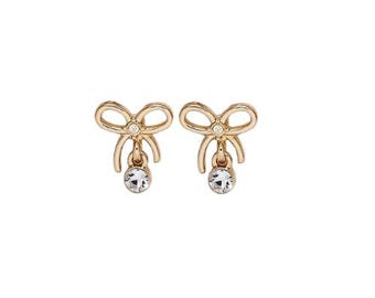 Pendientes de lazo dorado para niñas: preciosos pendientes de cristal, un delicado regalo para el día a día.