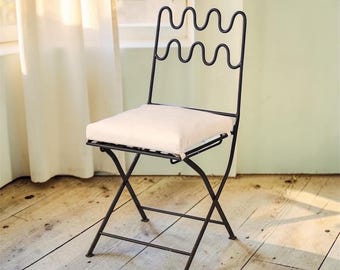 A set of 2, 3, 4 handmade wrought iron garden or patio chairs with an innovative, hand-carved back, a handmade home furniture chair.