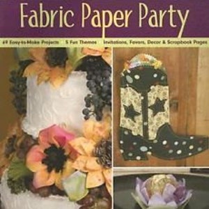 May include: A book titled "Fabric Paper Party" with a purple banner and images of crafts. The book cover features a white cake with floral decorations, a cowboy boot, and a wrapped gift. The book's subtitle reads "69 Easy-to-Make Projects & 5 Fun Themes".