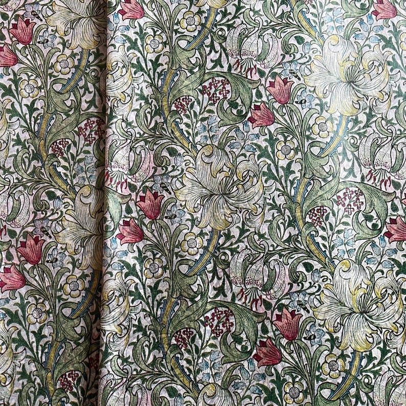 May include: A vintage floral wallpaper with a repeating pattern of lilies, leaves, and flowers in shades of green, white, and pink.
