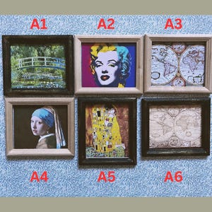 May include: Six miniature framed art prints. The prints feature famous artworks, including a Monet painting, a Warhol portrait of Marilyn Monroe, antique maps, and a Vermeer painting. The frames are in various colors, including black and light brown.