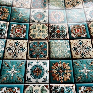 May include: Close-up of a tiled surface with a repeating pattern of square tiles. The tiles feature ornate floral and geometric designs in shades of teal, cream, and rust. The overall effect is a vintage or Mediterranean aesthetic.