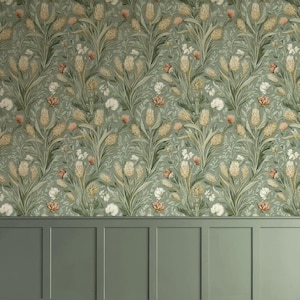 May include: Sage green wallpaper featuring a repeating pattern of wheat stalks, white flowers, and peach accents. The design evokes a vintage botanical print. The lower section of the image displays matching sage green wainscoting.