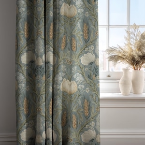 May include: Blue-green floral curtain panel featuring a repeating pattern of large cream-colored flowers, wheat stalks, and smaller white blossoms. The curtain is hanging in front of a window with two white vases and dried plants.