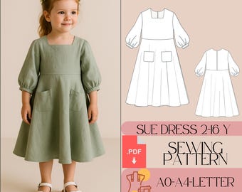 May include: A young girl wearing a sage green dress with a square neckline and puff sleeves. The dress has two front pockets and is paired with white sandals. The image also includes a sewing pattern for the "Sue Dress" for ages 2-16, with instructions.