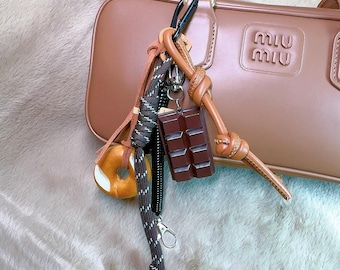 Leuke krakeling herentashanger, mooie bageltashanger, vriendelijke krakeling krakelingtashanger met chocolade, touw sleutelhanger portemonnee bedel accessoires