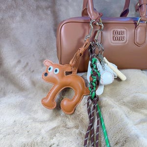 Stilvoller brauner Hunde Taschenanhänger, Baseball 3-teiliger Taschenanhänger, Surfbrett Schlüsselbund Seil Taschenanhänger für Geldbörse, stilvoller Schlüsselring Taschenanhänger, Geschenke