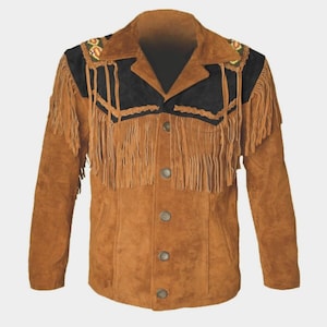 May include: A tan suede jacket featuring long fringe detailing across the chest and shoulders. The garment includes a black suede yoke with decorative embroidery on the collar, long sleeves, and a front button closure with four visible buttons.