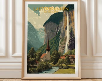 May include: Framed art print featuring a scenic view of Lauterbrunnen, Switzerland. The artwork depicts a waterfall cascading down a cliff, a church with a tall steeple, and surrounding mountains. The text "Lauterbrunnen Switzerland" is at the top.