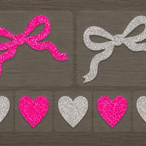 May include: A set of glittery craft decals featuring two large bows, one in hot pink and one in silver, accompanied by five smaller heart-shaped decals alternating between silver and hot pink glitter finishes on a dark wood-grain background.