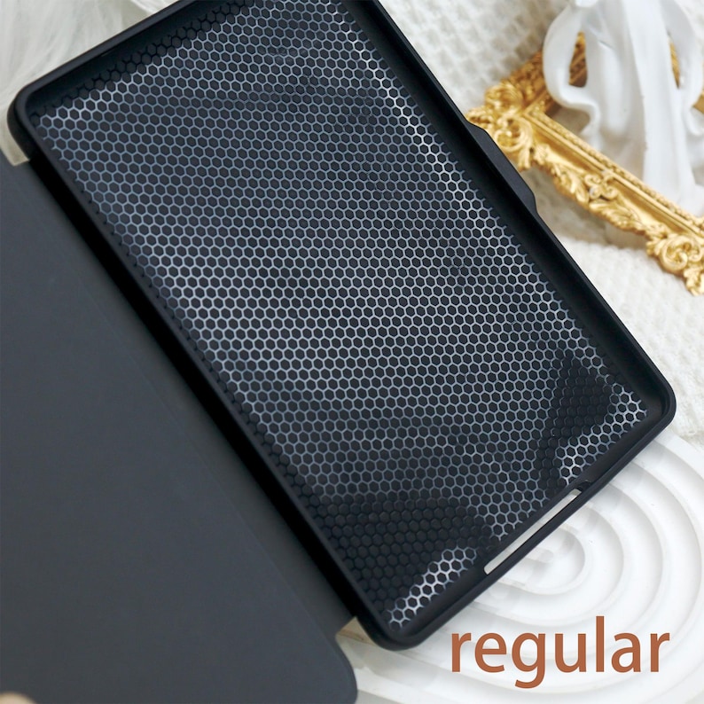 May include: A black case with a honeycomb pattern on the back. The case is open and the inside is black. The word "regular" is printed on the bottom right corner of the image.