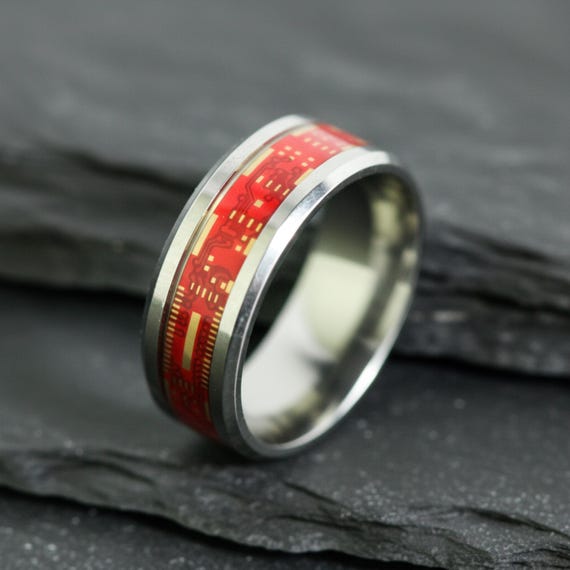 A wearable ring made from actual PCB (circuit board) material — genuinely one-of-a-kind tech jewelry that doubles as an anniversary gift for geeks.