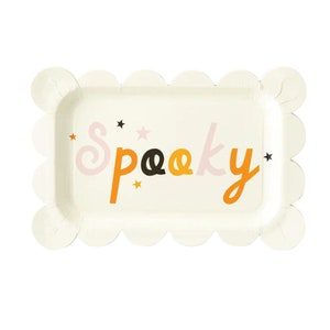 May include: White paper party plate with scalloped edges. The plate has a "Spooky" design with orange, pink, and black letters and black stars.