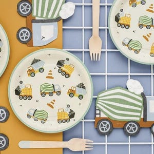 May include: Construction themed paper plates with a white background and colorful illustrations of dump trucks and cement mixers. The plates are perfect for a construction-themed party.