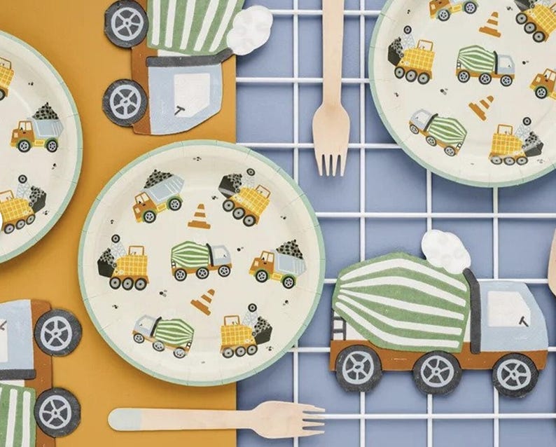 May include: Construction themed paper plates with a white background and colorful illustrations of dump trucks and cement mixers. The plates are perfect for a construction-themed party.