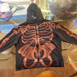 Bleach painted skeleton and wings zip-up hoodie