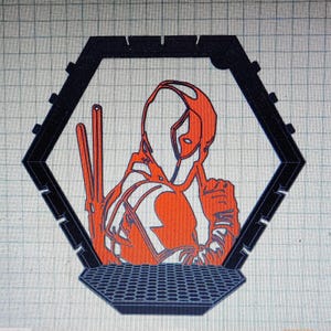 May include: Orange and black graphic of a character in a hexagonal frame. The character is wearing a mask and holding two swords. The frame has a honeycomb-patterned base.
