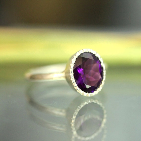 sterling silver ring filled with deep purple liquid