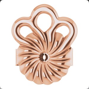 May include: Rose gold earring back with a swirl design and a decorative top with three loops.