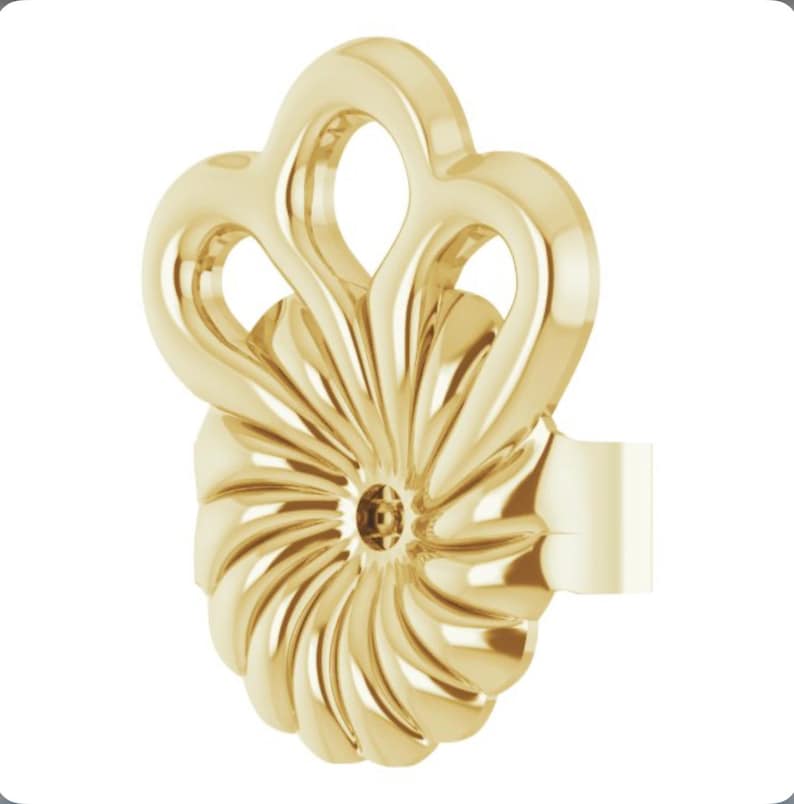 May include: Gold-toned earring with a swirl design and a decorative top with three loops.