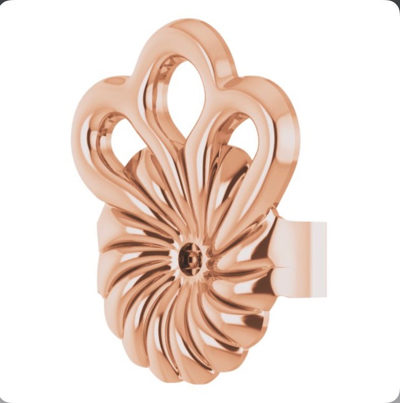 May include: Rose gold earring with a swirl design and a decorative top.