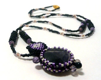 A Turtle Holds The Earth - Amethyst - beadwoven necklace and pendant