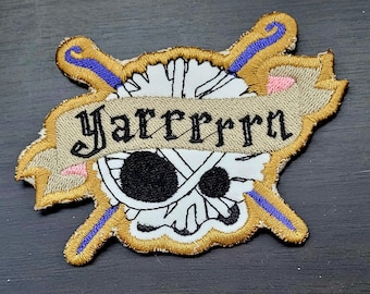 Yaaaarn!- Embroidered iron-on or sew-on patch - machine embroidered  3.5 inch shaped - pirate, skulk and knitting needles or crochet hooks