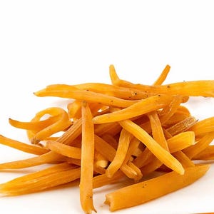 May include: A pile of dried, orange-yellow fingerroot pieces. The image includes text that reads "LIMITED STOCK" on an orange banner and "FREE SHIPPING" on a green banner. The Pure Herb Co. logo is also visible.