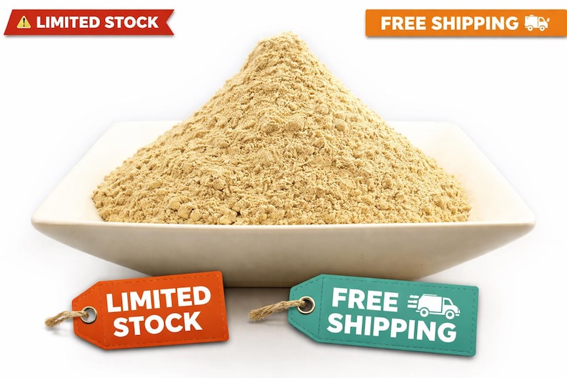 May include: A mound of light brown powder sits in a white, square, shallow bowl. The bowl is on a white background. An orange tag reads "LIMITED STOCK", and a teal tag says "FREE SHIPPING".