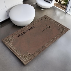 May include: A brown rectangular plaque with a gold ornate border and a cross design. The plaque has the text "YOUR NAME" in black lettering.