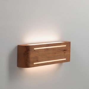 Solid wood curved egde sconce with light stripe
