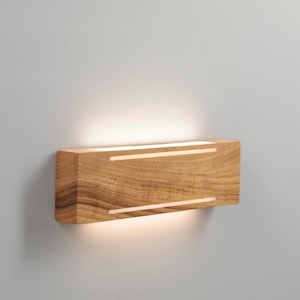 Solid wood sconce with light stripe