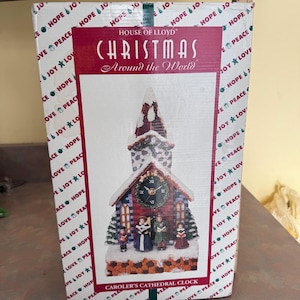 Lloyd-Around the world Christmas carolers cathedral clock