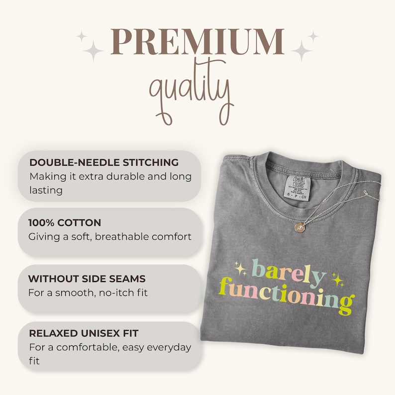 May include: A gray t-shirt with the words "barely functioning" in pastel colors. The shirt has a relaxed unisex fit and is made of 100% cotton. Features include double-needle stitching and no side seams.