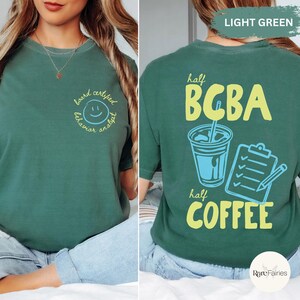 Funny BCBA coffee shirt with half BCBA half coffee design, featuring iced coffee cup and clipboard graphics on Comfort Colors tee for ABA therapists and behavior analysts