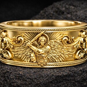 Anillo del Arcángel San Miguel, joyería de plata de ley con espada de ángel guerrero y cabeza de demonio. imagen 3