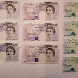 May include: Ten 20 pound notes from the Bank of England featuring a portrait of Queen Elizabeth II. The notes are in various states of wear and tear.