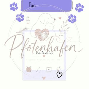May include: A white binder cover titled Betreuungsordner with purple paw prints and a purple label for a name. It features a line drawing of a dog and cat, a heart, a lighthouse, and the text Pfotenhafen, Futterplan, Medizinisches, and Packliste.